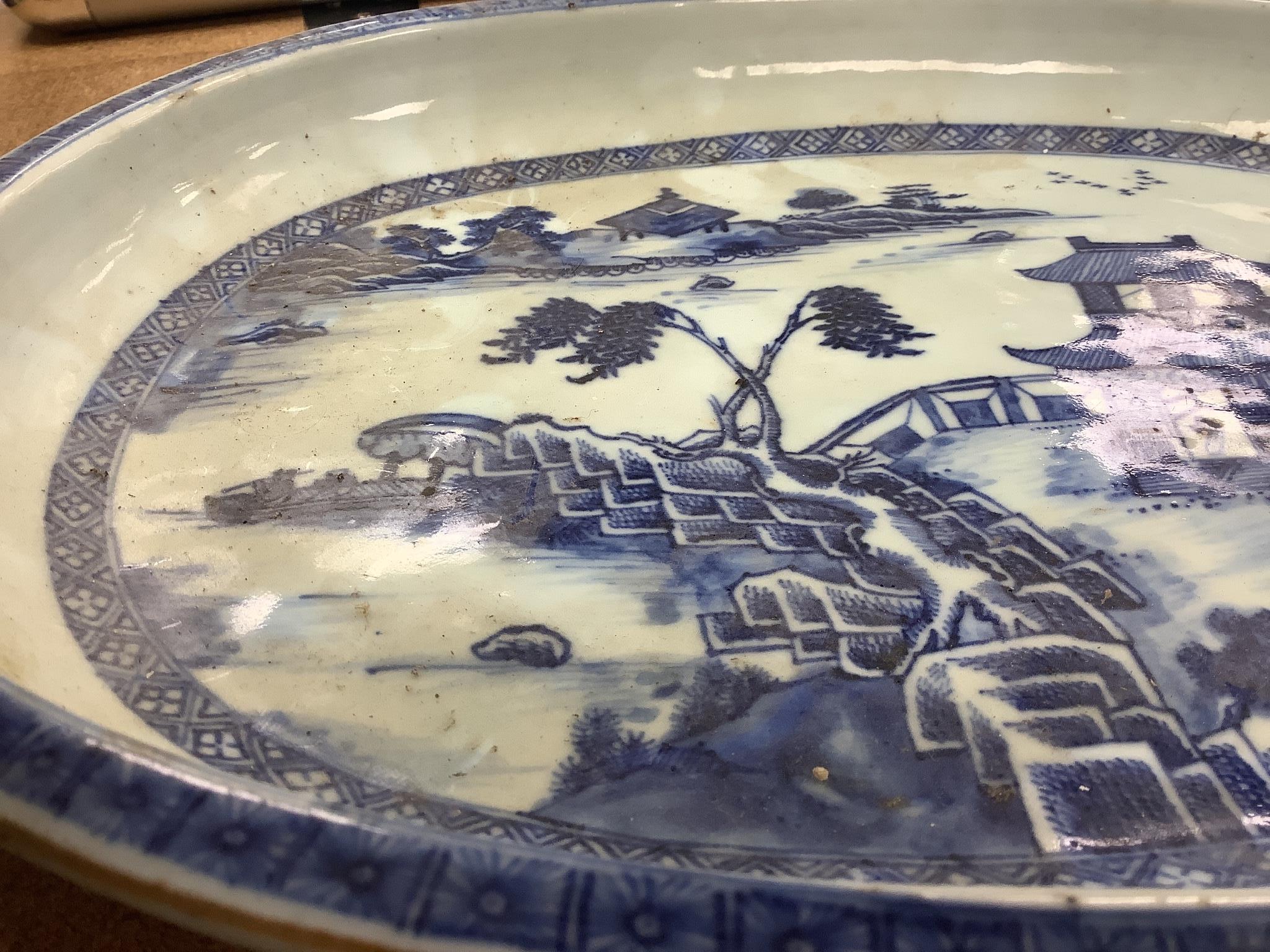 An 18th century Chinese export oval blue and white dish, 32cm.
